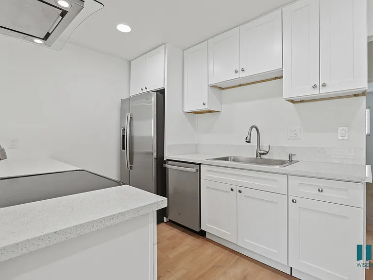 Kitchen with Stainless-Steel Refrigerator, Dishwasher, and Stove