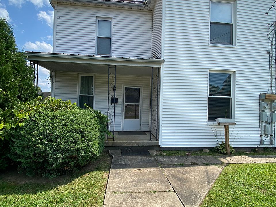 Entry door to first floor 2 bedroom 1 bath unit. Small porch with room for two lawn chairs to sit. Quiet street, less than a block from WVWC campus.