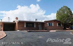 Huge circular driveway and one-car carpo