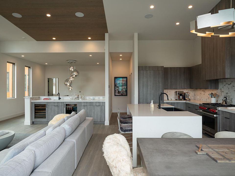 High Ceilings, hardwood floors, open and naturally bright. Hallway provides access to the powder room.