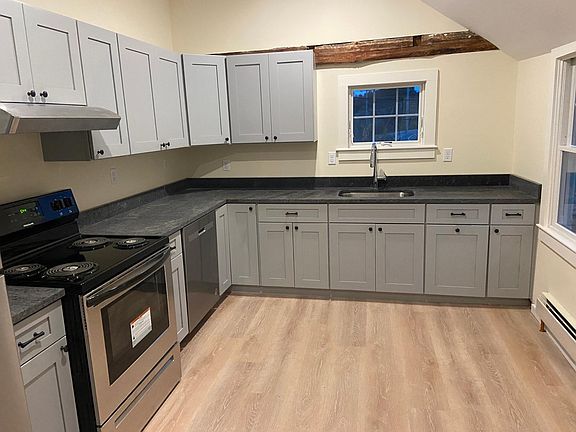 All new kitchen, cabinets, floor, appliances. Includes dishwasher.