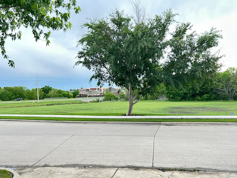 Front overlooking greenery.
