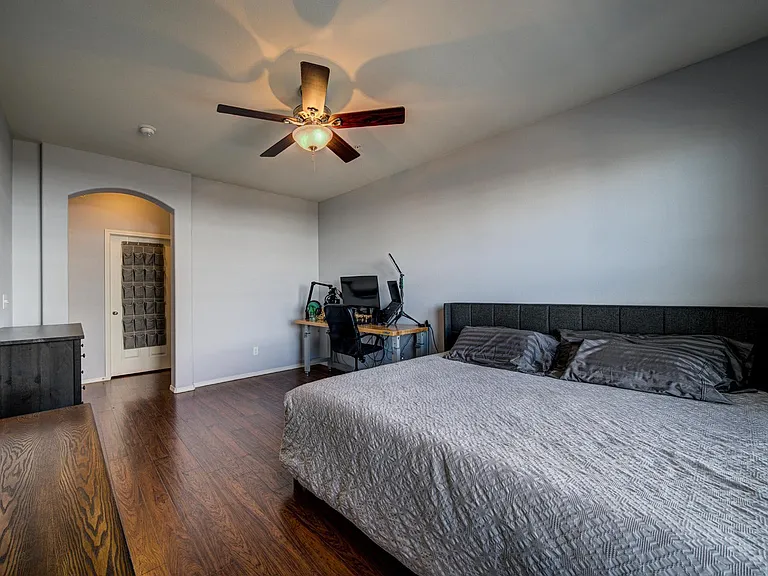 Master suite with walk in closet across the hallway and bathroom to the right.