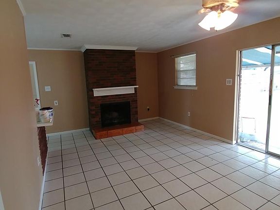 Ithaca den with fireplace and wet bar