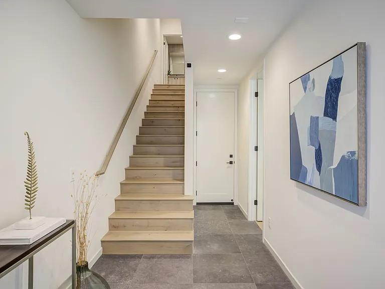 Spacious entryway with ample room to welcome guests and create a warm first impression.