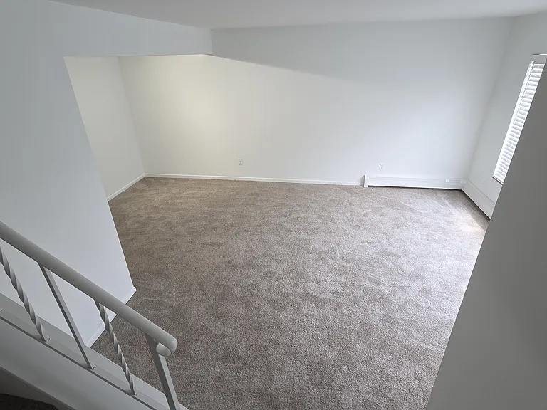 Elevated view of the spacious living room and open floor area.
