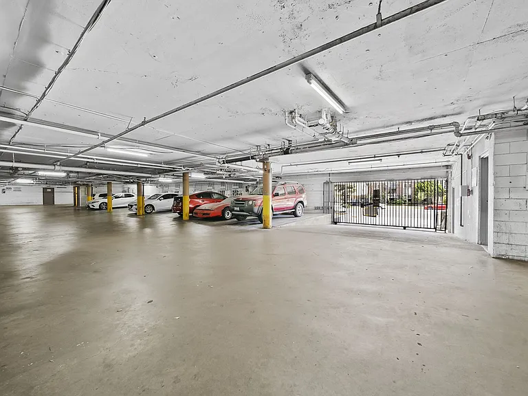 Secure, gated parking garage offering ample covered parking for resident convenience.
