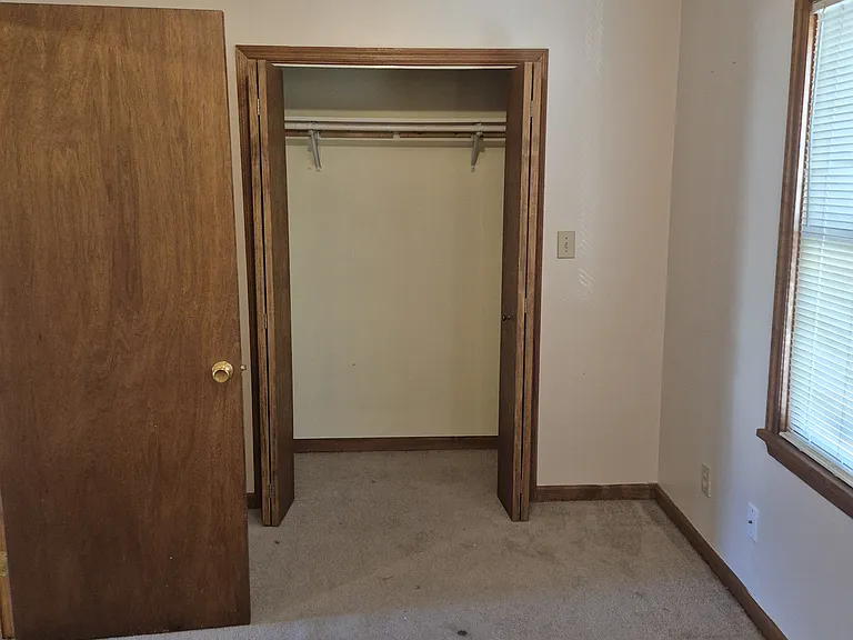 Master bedroom, located off dining room, view toward closet