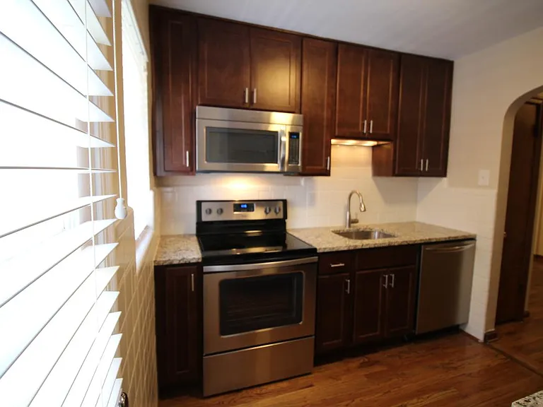 Renovated kitchen, granite counters, stainless appliances in
