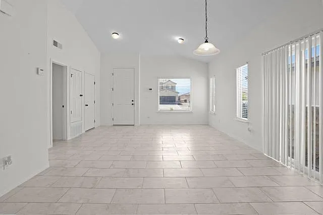 Open concept. Large windows and double glass doors leading outside