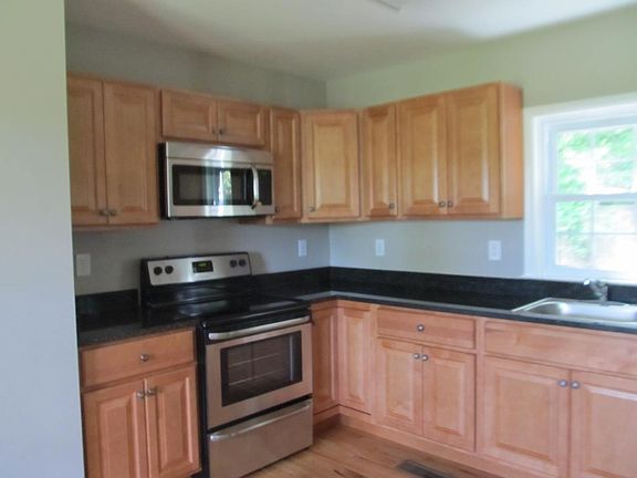 Kitchen with Granite Countertop (Open Plan to Dining Room -