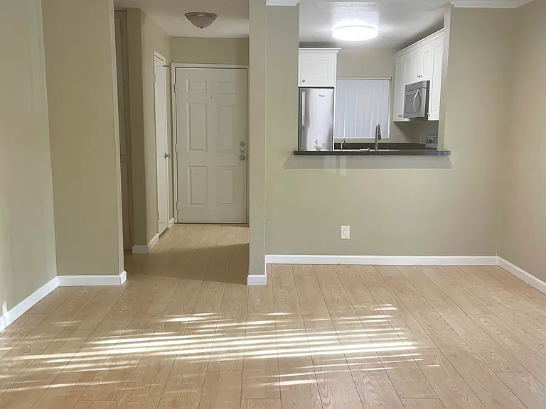 Living Room (looking from patio to entrance)