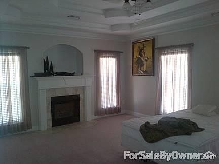 Master Bedroom
						:
						Beautiful trayed ceiling, crown molding, ceiling fan and fireplace