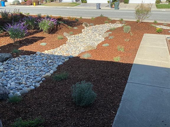 Dry river bed that flows from house