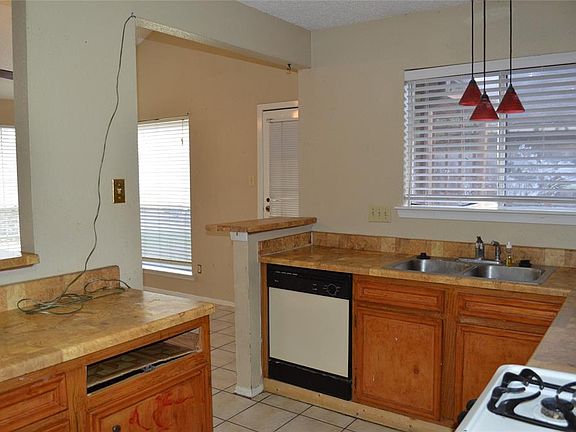 Kitchen with pendant lighting and plenty of workspace