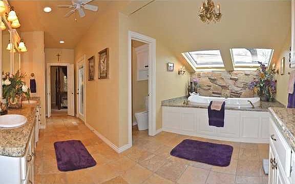 Master Bathroom with heated floors, large whirlpool tub, large steam shower, 2 sinks and make-up vanity