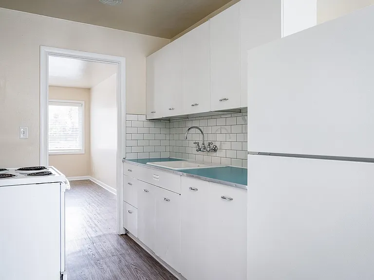 Clinton Court| Kitchen with White Cabinets