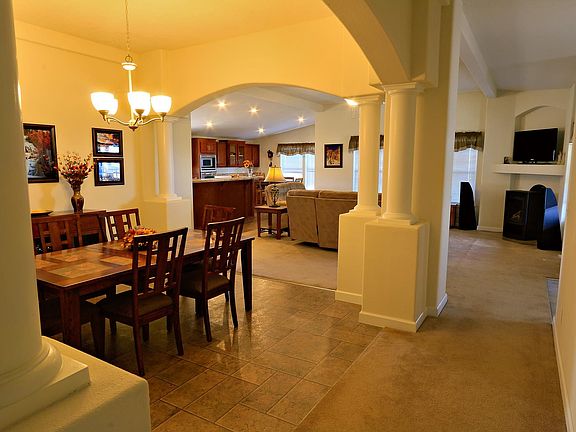 Dining Room, Living room with freestanding propane fireplace, kitchen & breakfast nook.