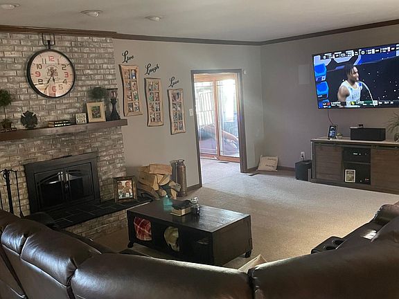 Living room w/wood burning fireplace