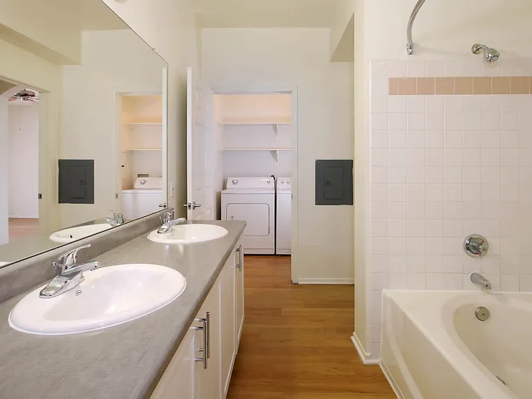 Bathroom with Double Vanity and In-home Washer and Dryer
