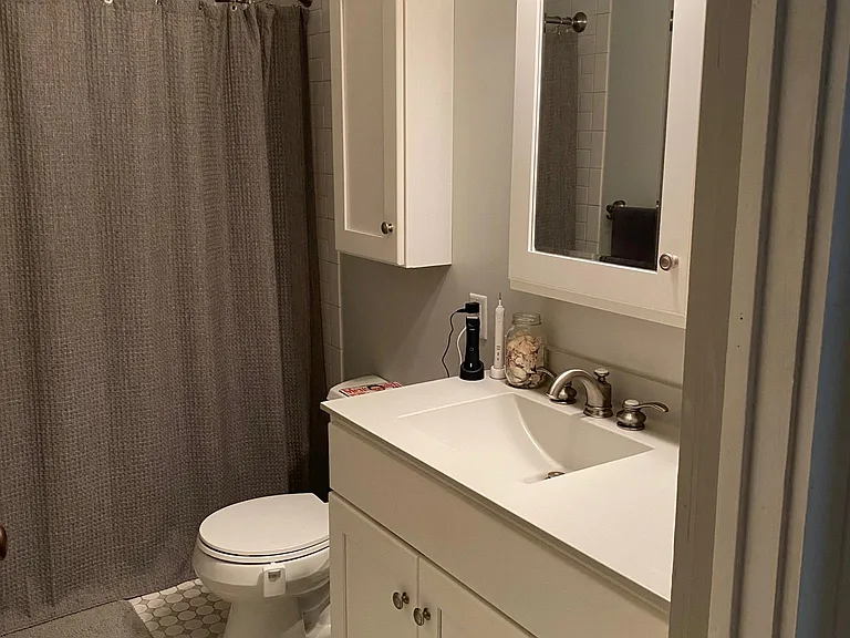 Bathroom with ceramic tile floor and super quiet Panasonic bathroom vent with humidity sensor - only comes on when necessary.