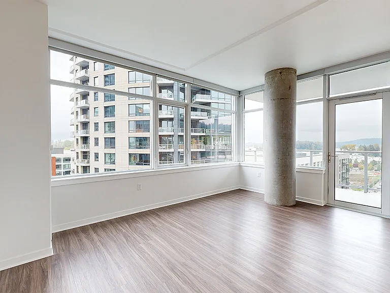 Apartment living room with wood-style flooring.