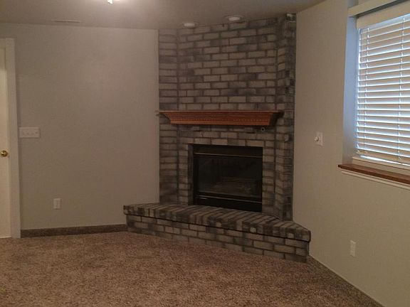 Family room in lower level with gas fireplace