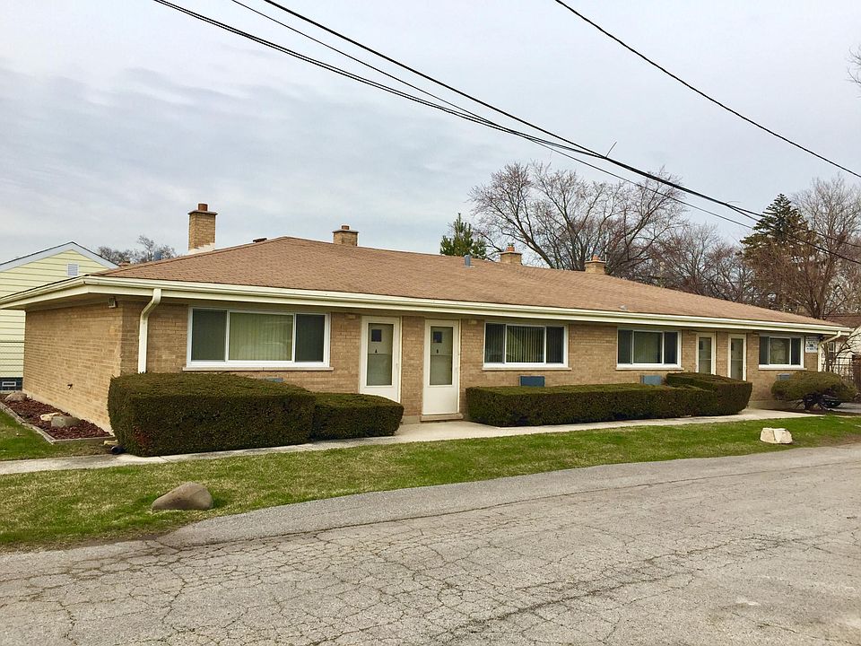 From exterior. Brick building in quiet cul de sac. Assigned 