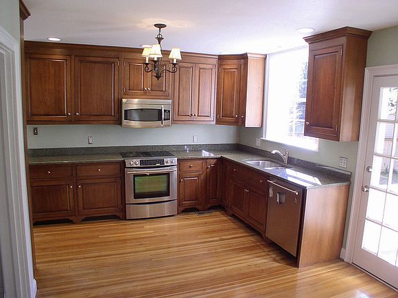 New custom kitchen with granite counters and stainless appliances