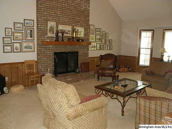 Great Room with vaulted ceiling and fireplace