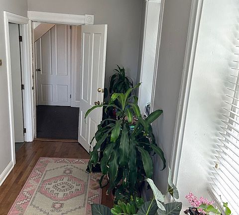Entry way with washer and dryer directly across the hallway.