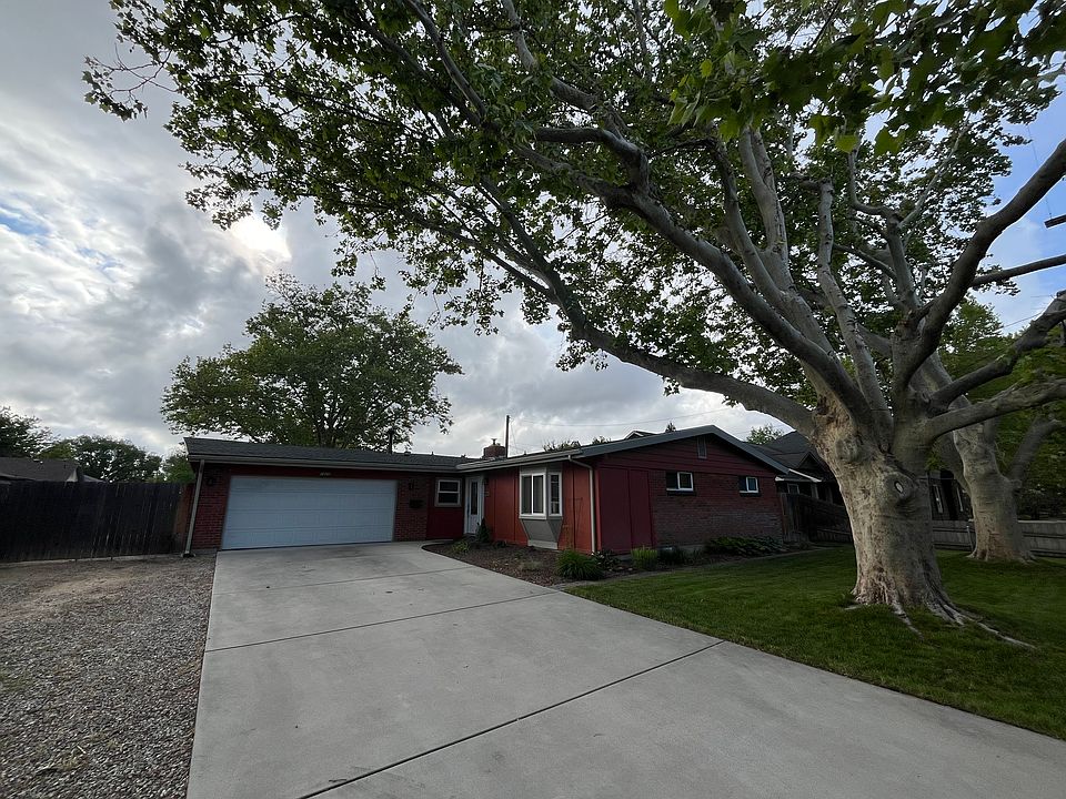 Home exterior, protected by privacy shrubs and mature trees. Extra long driveway with additional RV parking space.