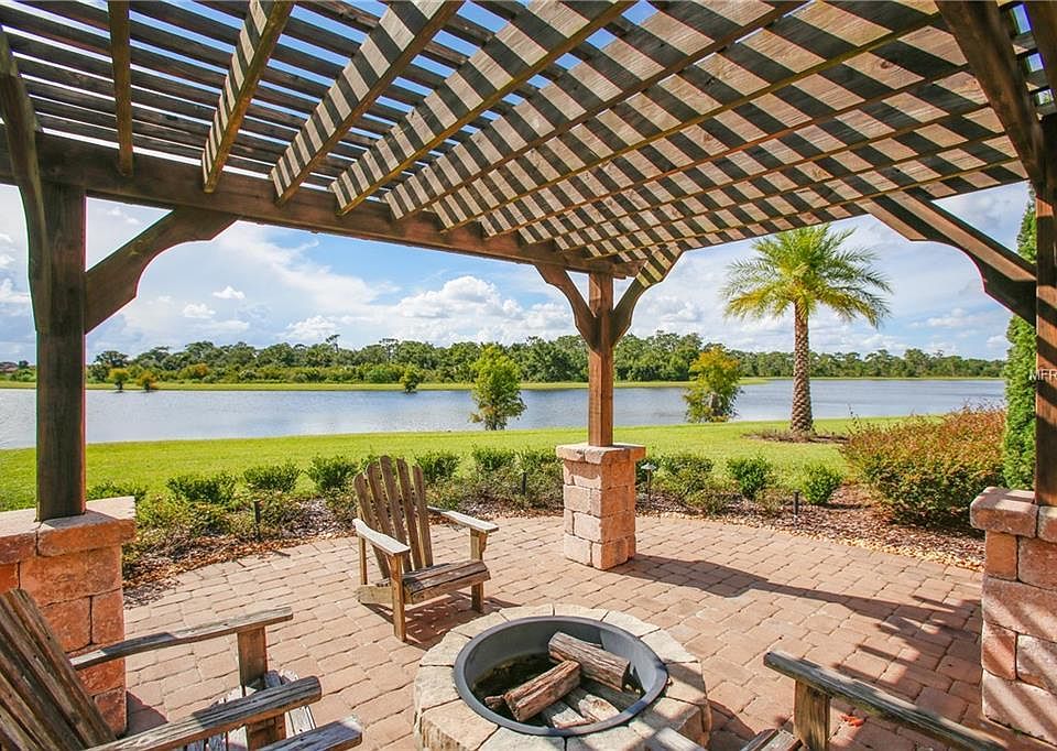 Immerse yourself in luxury and style as you enjoy the picturesque vistas from this former model home turned waterfront haven!