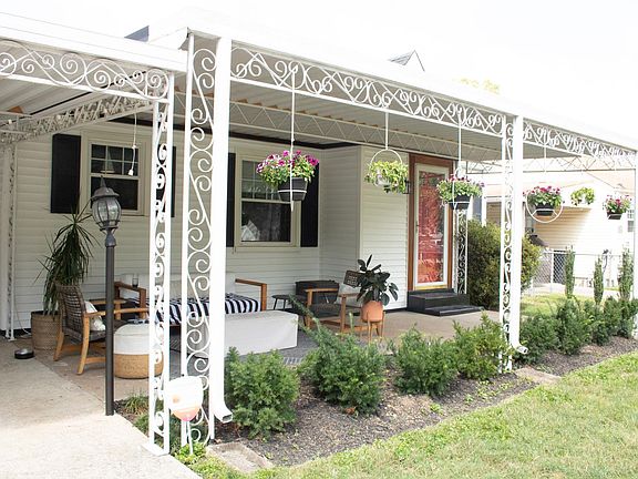 Covered front porch is perfect for entertaining