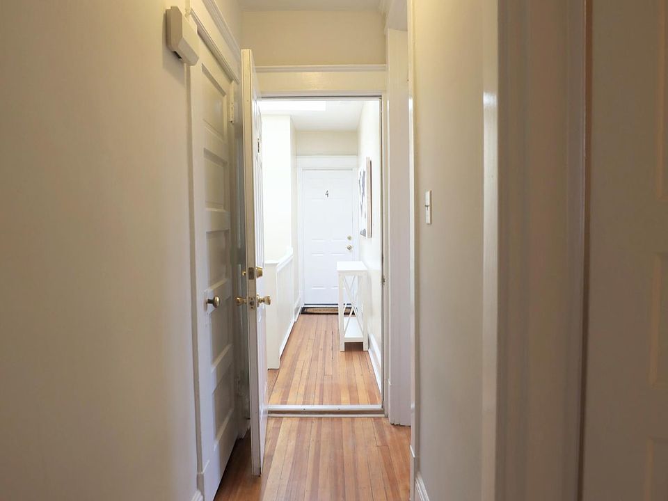hallway showing the entry closet on left and looking out into the building hallway.