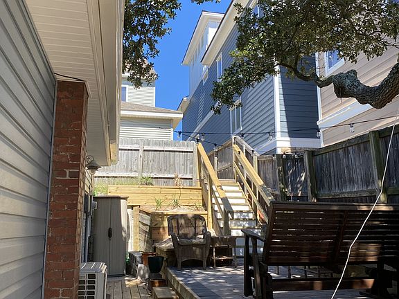 Outdoor patio deck and access to the beach up the steps
