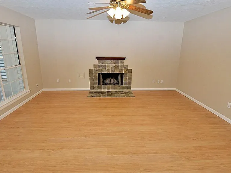 A nice fireplace stays out of the way for TVs or stereo.