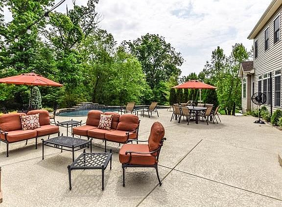 Outdoor living room and pool. Cool deck finish