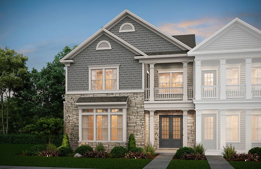 Fairmont Exterior 3 features shakes, stone, covered porch and deck, and 2 car rear garage