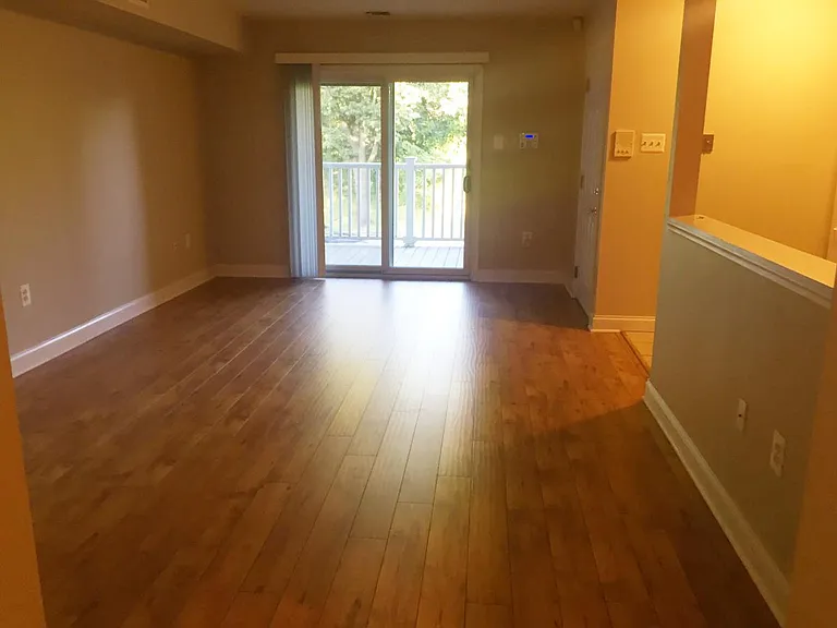 Family room/dining area with access to balcony.