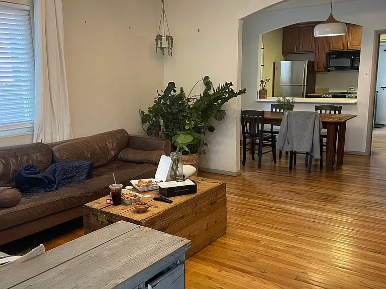 living room viewing into dining and kitchen
