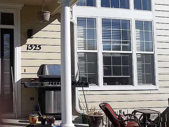 Front - look at all those windows and that cute patio, appro