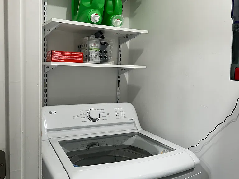 in unit laundry room with washer and dryer