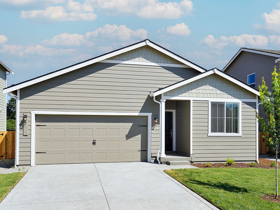 Beautiful single story home at Connell Park with siding and front yard landscaping