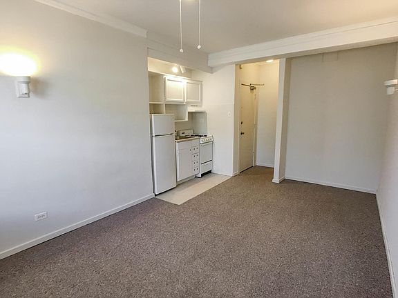 Studio 1 - Front facing apartment has street and tree views. Upper floors have a lake view.