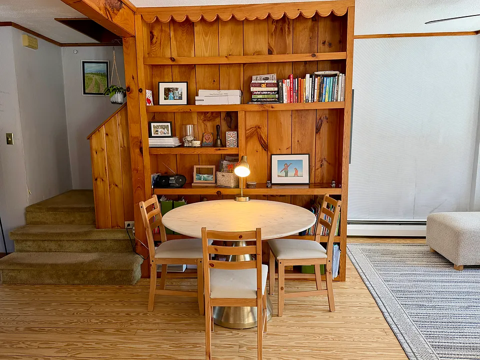 dining area with large bookshelf