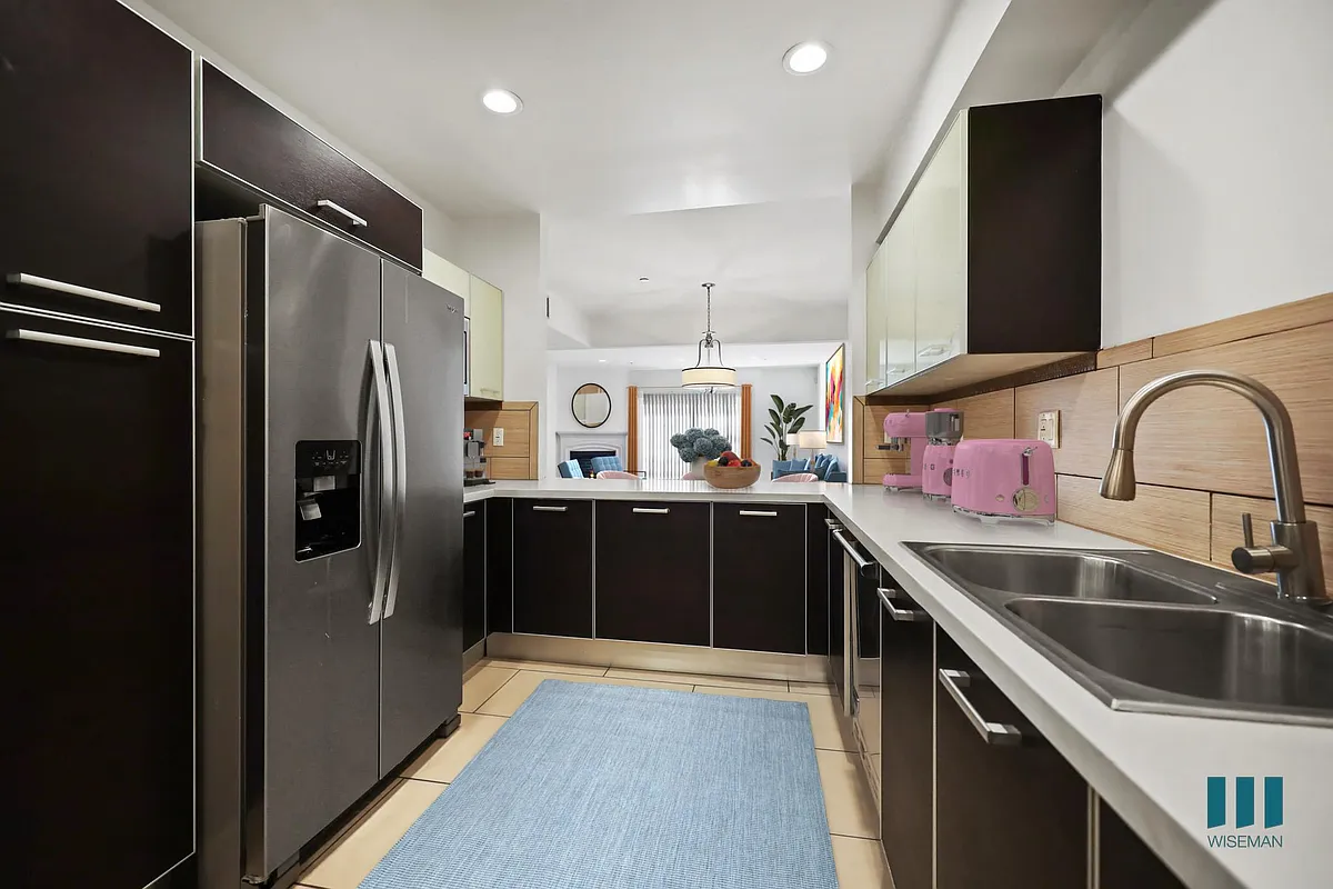 Open-Concept Kitchen with Stainless-Steel Appliances - Sweetzer on Third by Wiseman