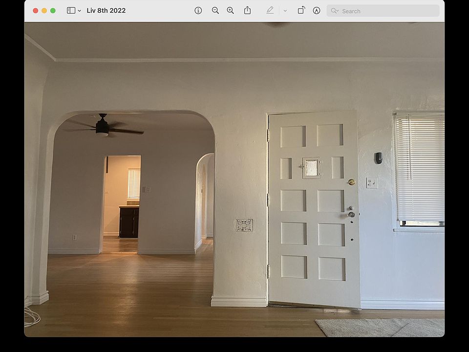 Living room; looking into dining room, breakfast nook and kitchen entrances.