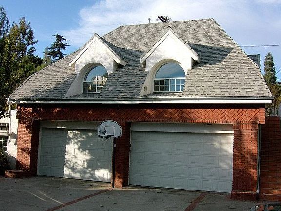 Spread out in the 4 car garage, office on left side