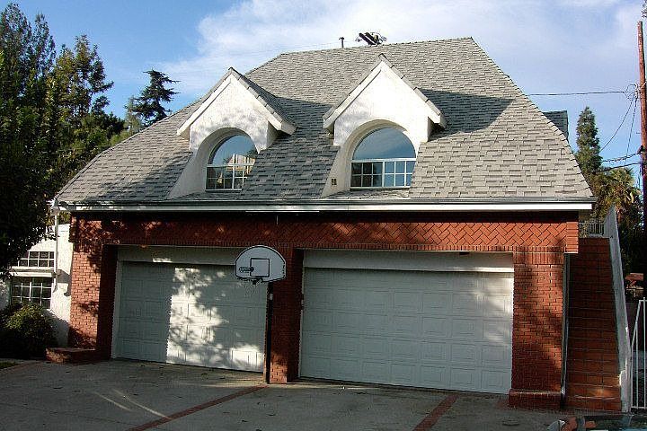 Spread out in the 4 car garage, office on left side